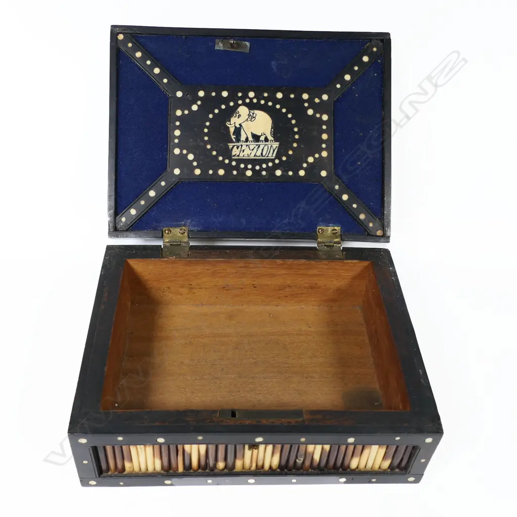 A late 19thC Ceylonese porcupine quill box, with hinged casket lid, the quill panels framed by ebony inlaid with bone rondels. 210 x 160 x 85mm Image 1++