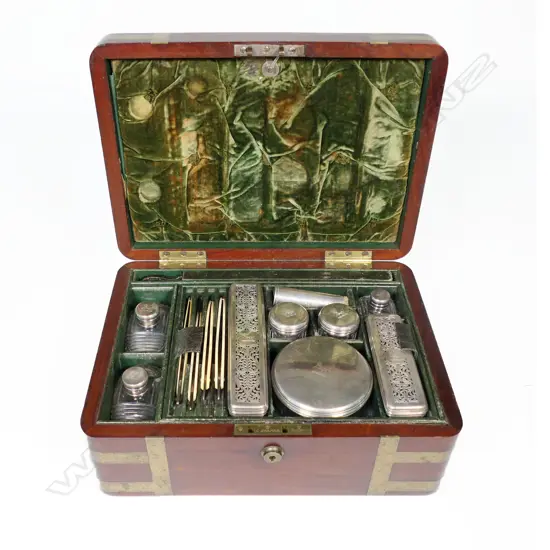 A good George IV period brass bound mahogany gentleman's dressing case by Thomas Briggs* 27 Piccadilly, London, with sterling silver capped cut crystal bottles and jars by John & Archibald Douglas, London 1825,