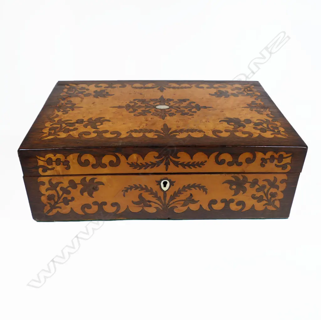 A Victorian birds eye maple and rosewood marquetry veneered workbox, with a symmetrical floral silhouette pattern. With key. 350 x 235 x 120mm Image 1++
