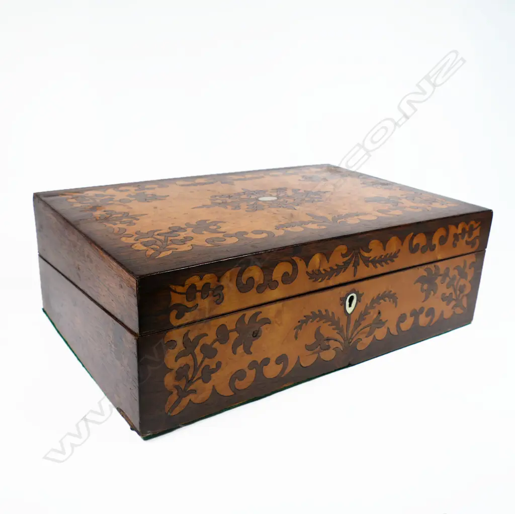 A Victorian birds eye maple and rosewood marquetry veneered workbox, with a symmetrical floral silhouette pattern. With key. 350 x 235 x 120mm Image 1++