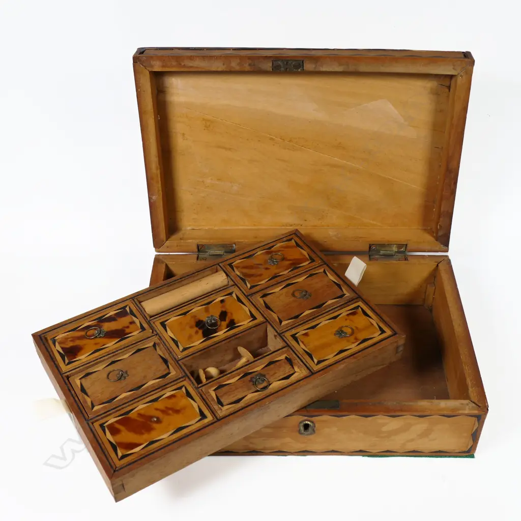A small workbox, with multiple lidded compartments, most tortoiseshell veneer missing. 250 x 170 x 80mm Image 1++