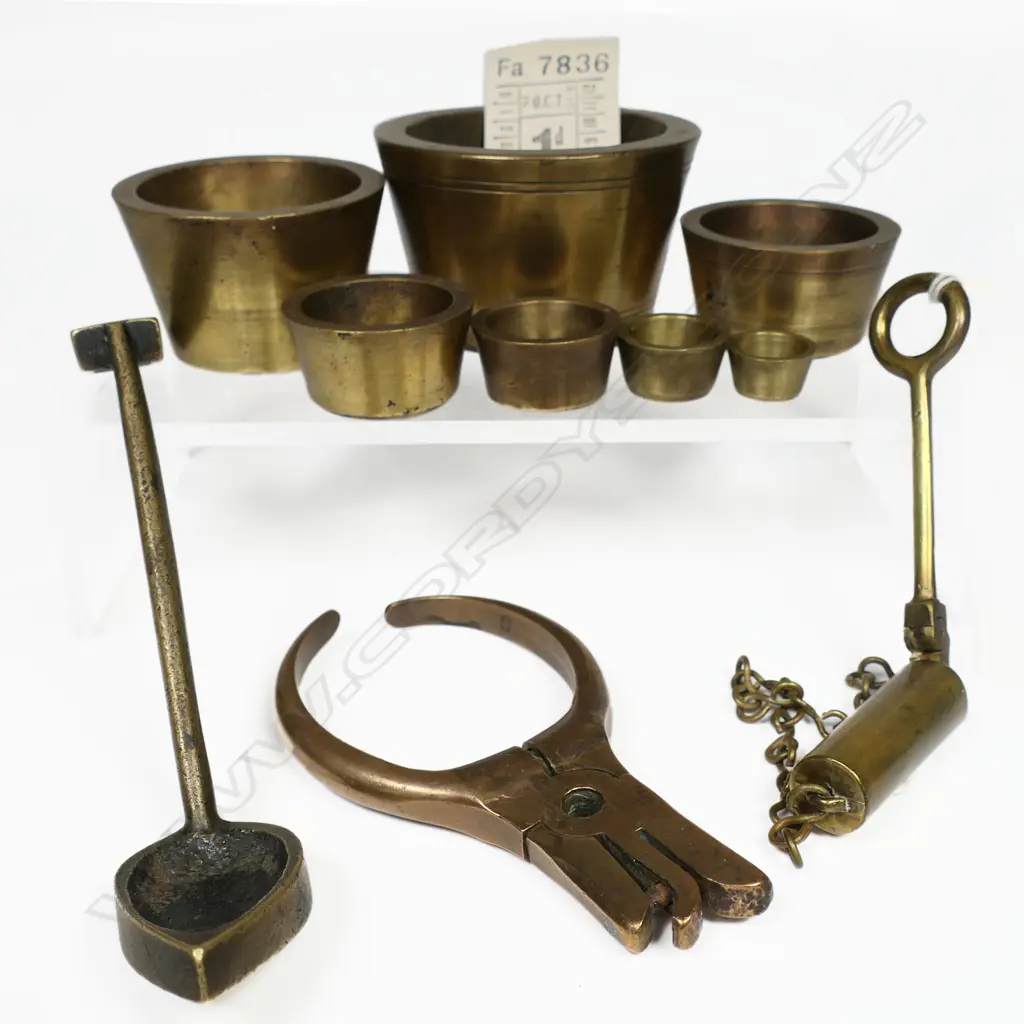 Conductor's ticket punch; set seven brass bucket weights ¼oz-16oz Troy; armourer's barrel inspection tool; and brass foundry sand moulding tool. Image 1++