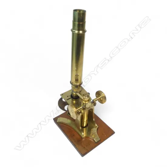A 19thC brass monocular microscope by Charles Collins, Optician, 157 Gt. Portland St., London,