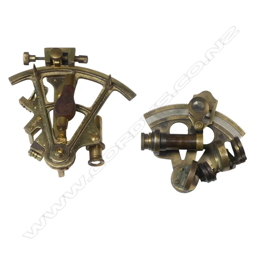 Two 20thC replica brass miniature sextants, both marked Stanley, 4" arc with military arrow and date 1916, the smaller 2½" arc dated 1884. With leather cases. Image 1++