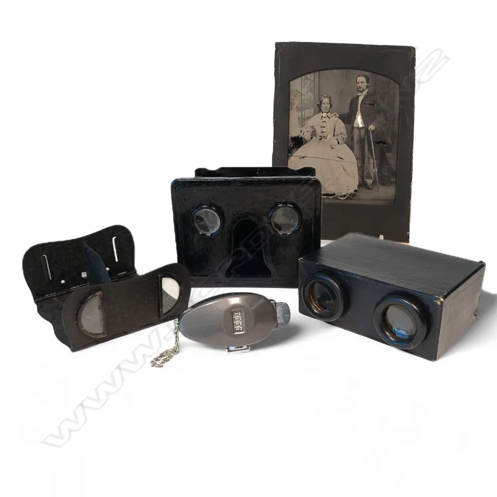 Three vintage folding stereo viewers, a glass ambrotype of a couple and four-digit attendance counter, Image 1++