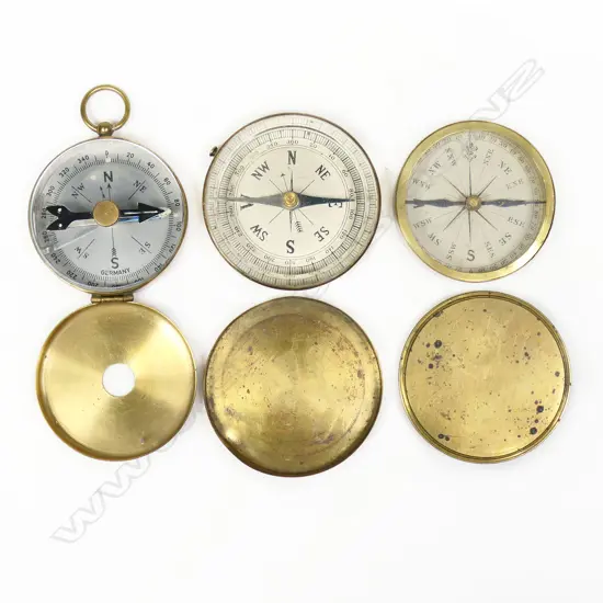 Three brass cased pocket compasses, c.1900, two with press lids, one with hinged lid,