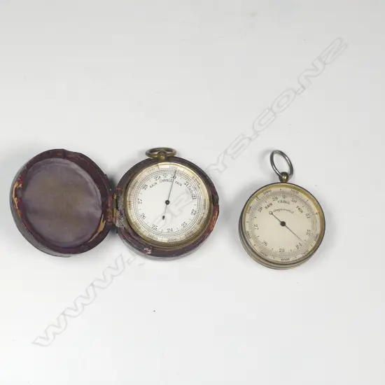 Two 19thC brass pocket aneroid barometer-altimeters, one red leatherette cased, both with suspension rings,
