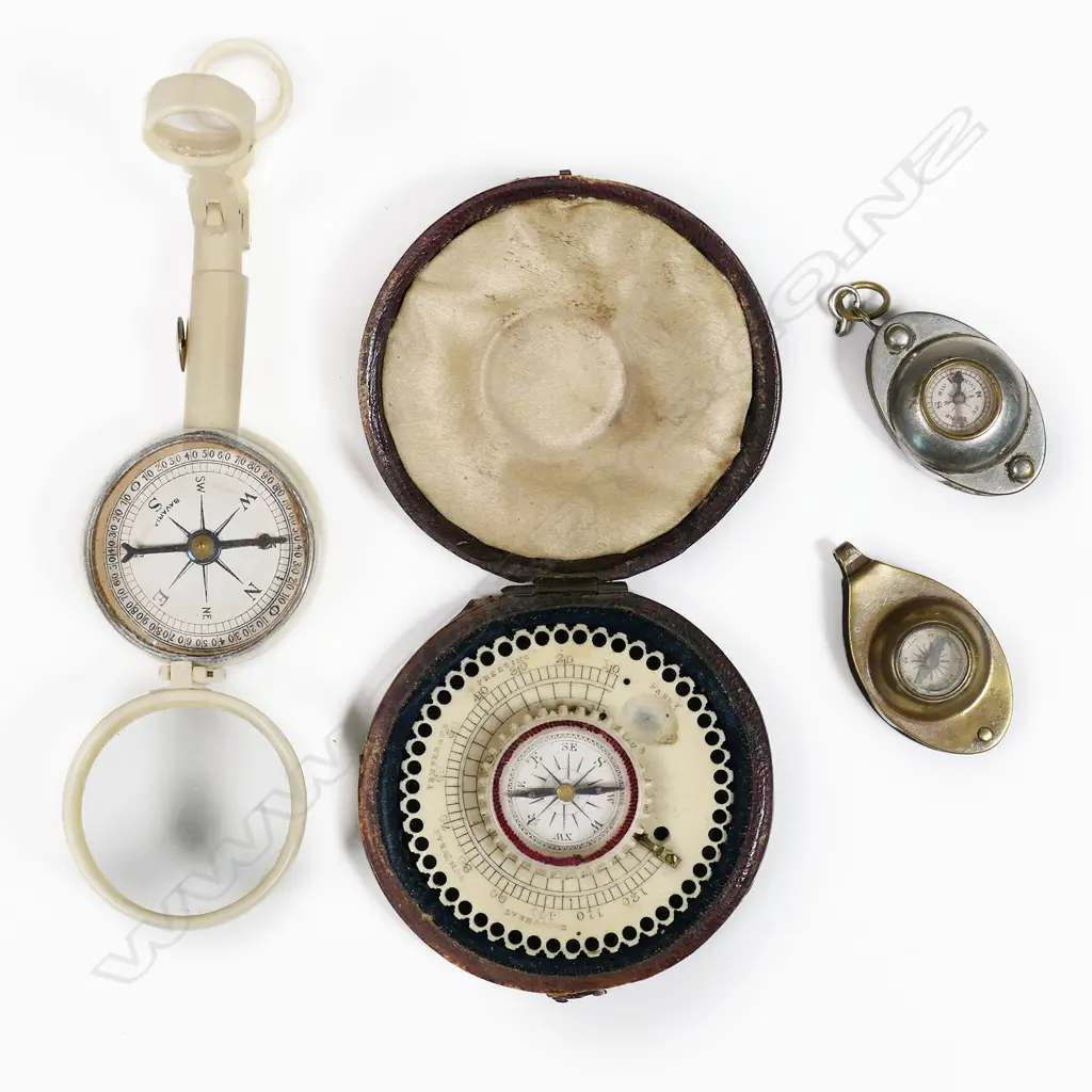A German celluloid folding combo mirror, compass, loupe and opera glasses; leather cased mid-19thC ivory pocket compass (thermometer absent); two mini fob compasses with fold out magnifying glass to one and coin silo to the other. Image 1++