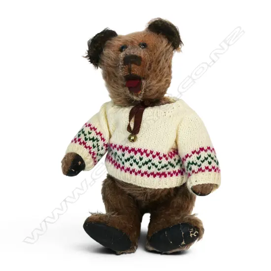 An early 20thC teddy bear,
