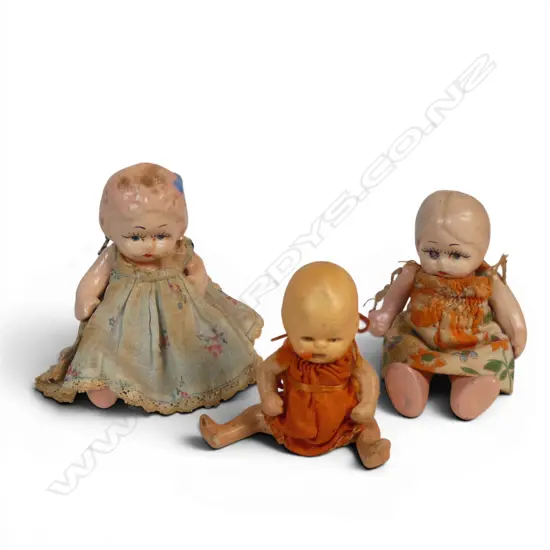 Three vintage painted ceramic small dolls,