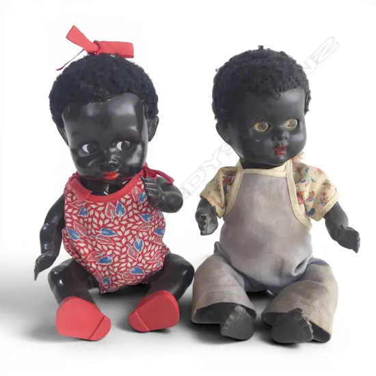 Two black Pedigree boy and girl dolls,