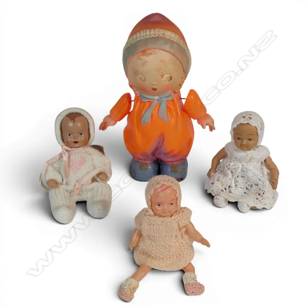 Four celluloid dolls - three miniature and one Boo Boo orange doll, Image 1++