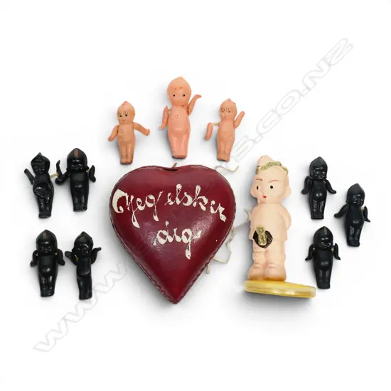 Collection of miniature Kewpie dolls including a vintage heart container,