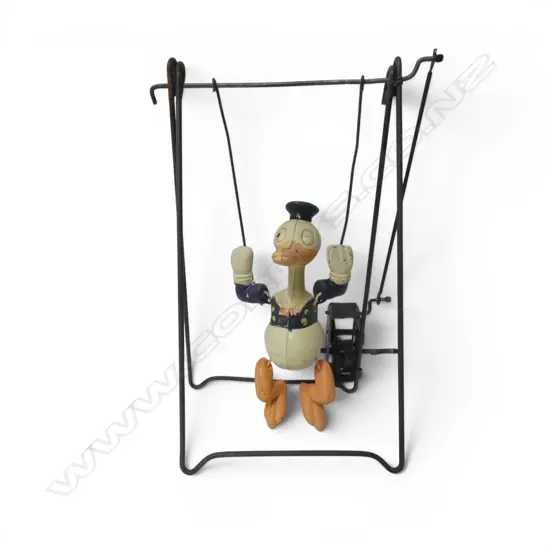Vintage Disney wind-up Donald Duck trapeze acrobat toy,