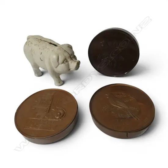 Cast iron Piggy Bankand three coin shaped money boxes,