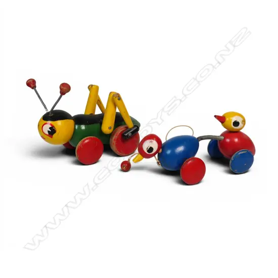 Two vintage wooden pull-along toys; a Kris Cricket and Dorable Duck,