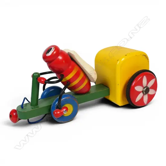Vintage wooden pull-along toy bee on tricycle,