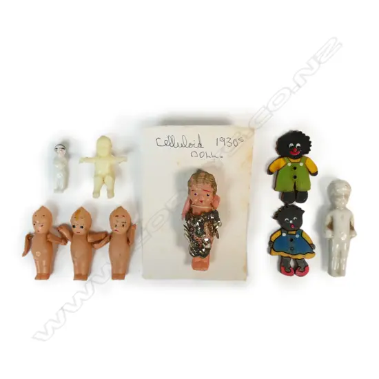 Nine small vintage dolls including a Frozen Charlotte