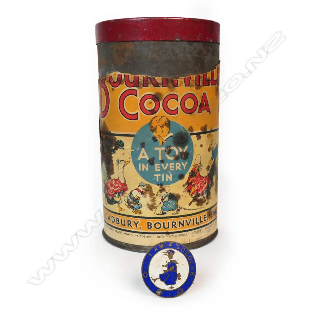 c.1930's Cadburys Bournville Cocoa tin with most paper label 'A Toy in Every tin' and collector's enamel badge, Image 1++
