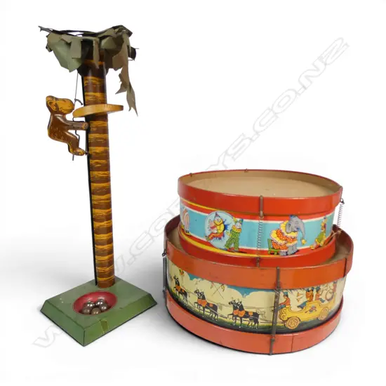 1940s mechanical monkey and palm tree toy H. 470mm and two toy drums decorated with circus scenes