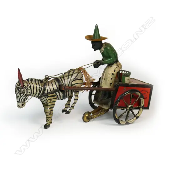 A Lehmann tinplate clockwork Dare Devil toy of a zebra pulling a man on a cart
