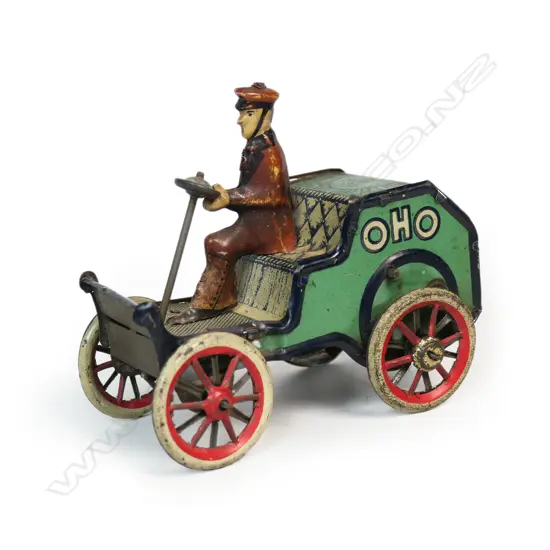 A Lehmann tinplate clockwork OHO toy of a man driving a car with upright steering wheel