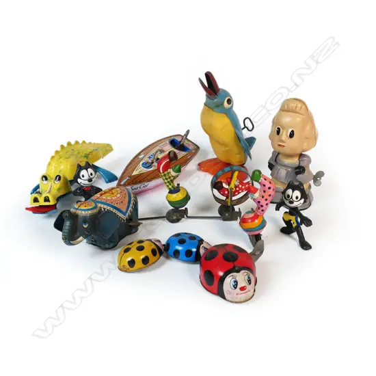 Group of assorted metal and plastic vintage wind-up toys,