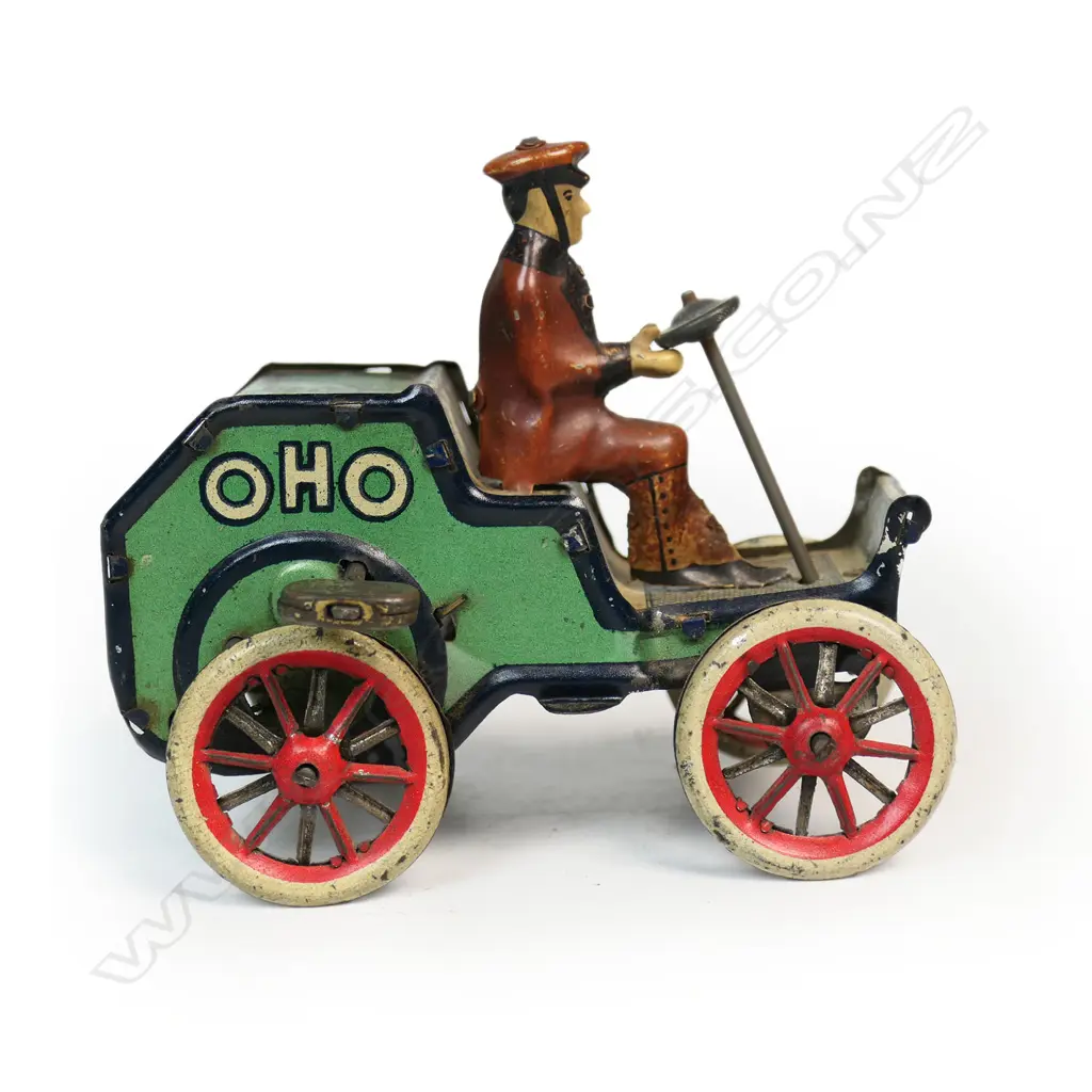 A Lehmann tinplate clockwork OHO toy of a man driving a car with upright steering wheel Image 1++