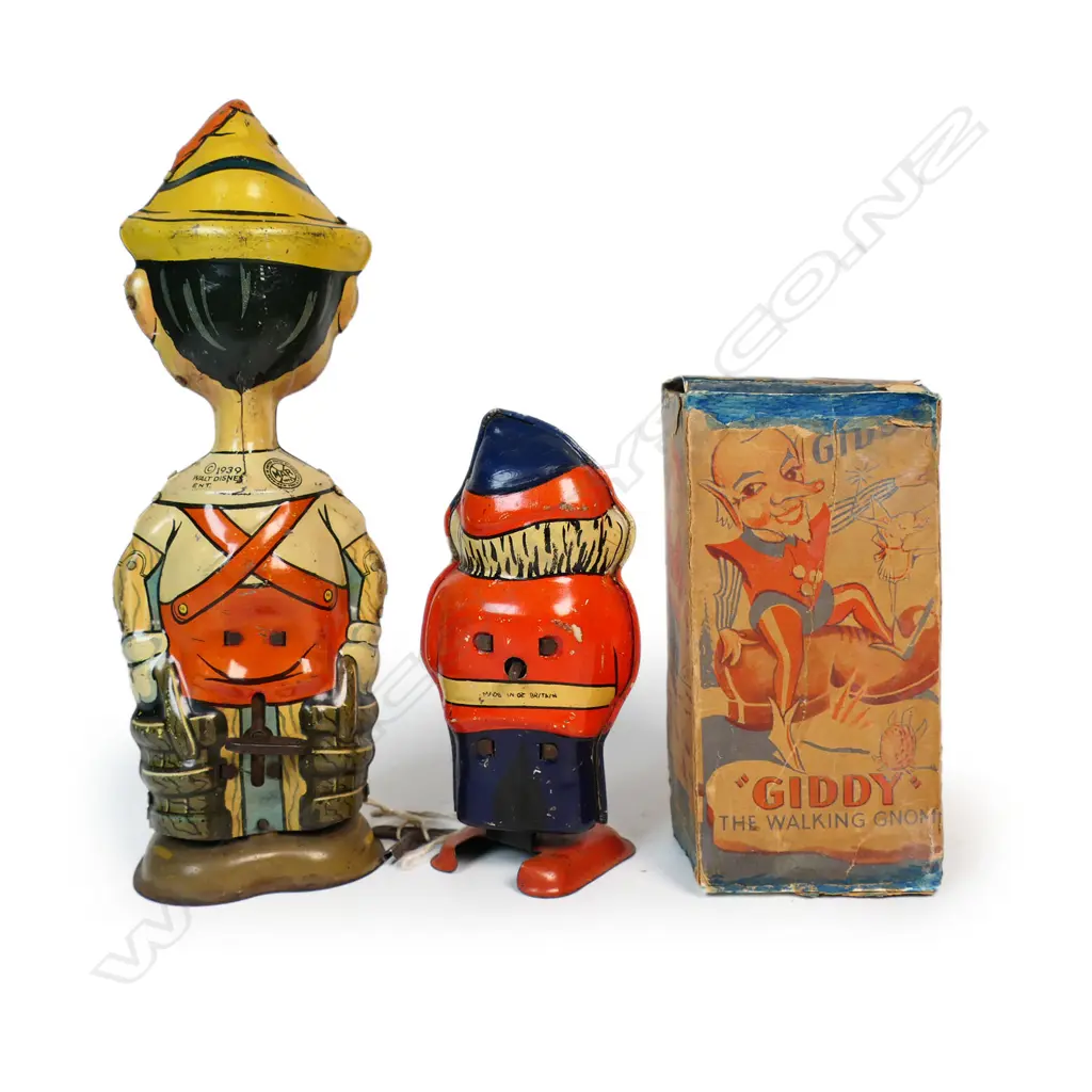 A Marx Pinocchio wind-up walker toy with a boxed 'Giddy' the walking gnome mechanical figure Image 1++