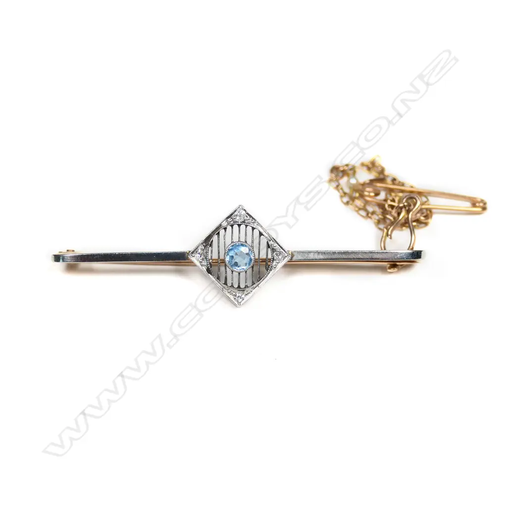 An Art Deco 15ct gold diamond and blue stone bar brooch, Image 1++