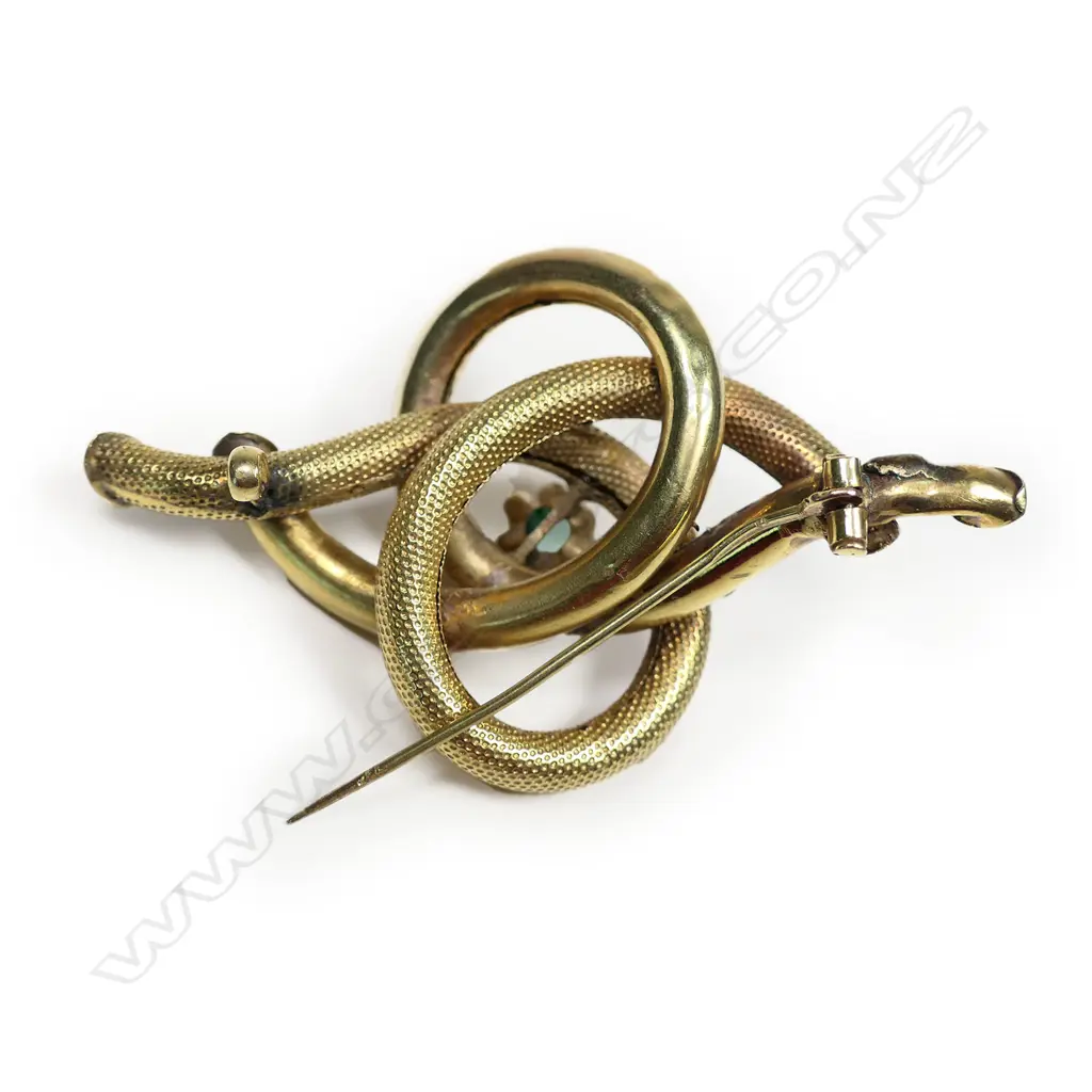 A Victorian 9ct gilt imitation pearl and imitation emerald knot brooch, Image 1++