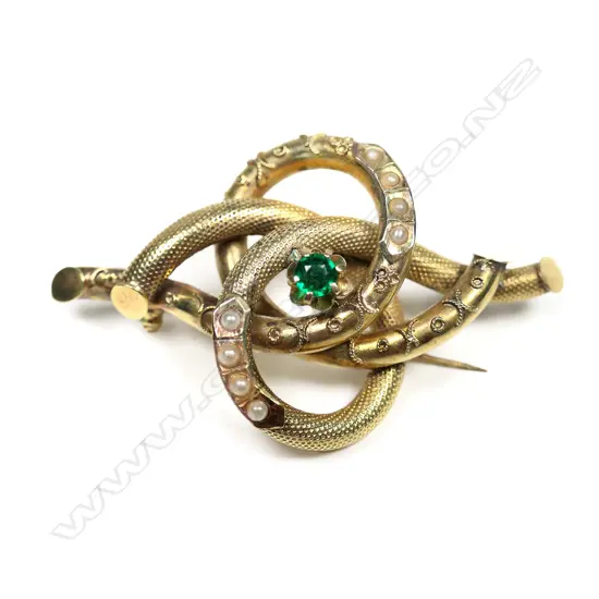 A Victorian 9ct gilt imitation pearl and imitation emerald knot brooch,
