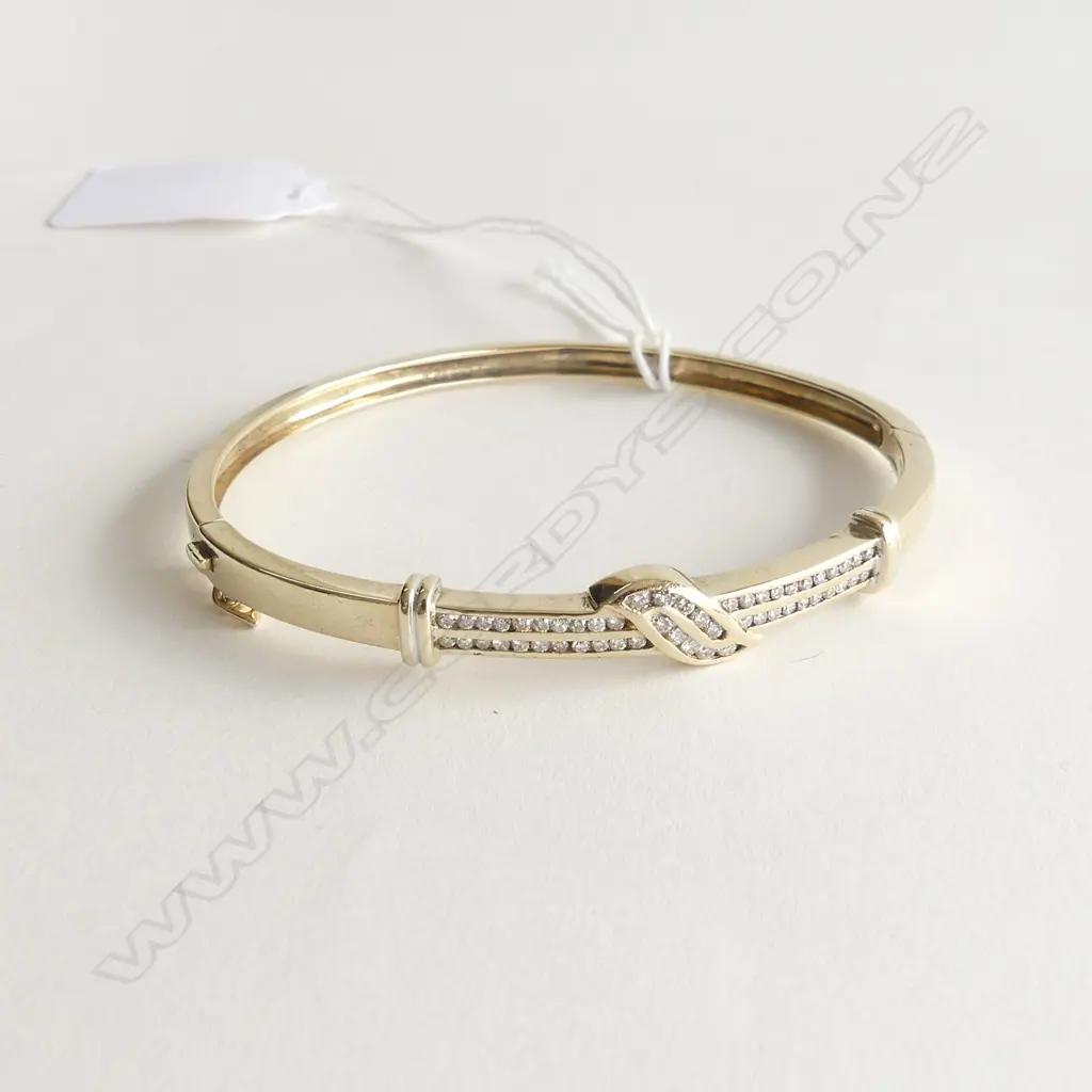 9CT GOLD AND DIAMOND SET BANGLE 0.68CT Image 1++