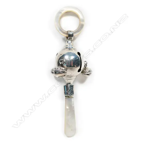 An early 1900s silver and mother of pearl baby rattle,