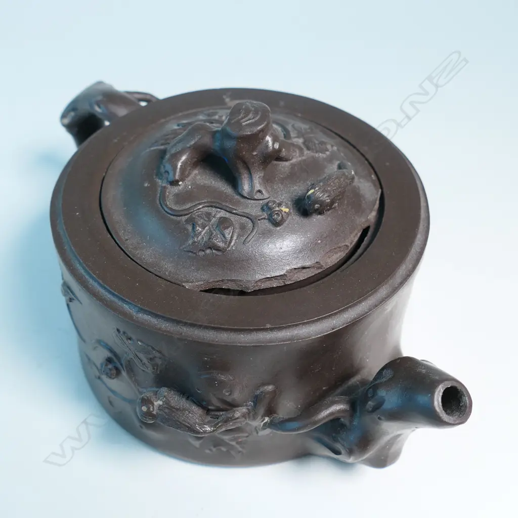 YIXING TEAPOT MARKED 蔣鳳英制 (JIANG FENGYING)  BASE 鳳英 (FENGYING) COVER. DARK BROWN, NATURALISTIC MODELLED. CHIPS. W.160mm Image 1++