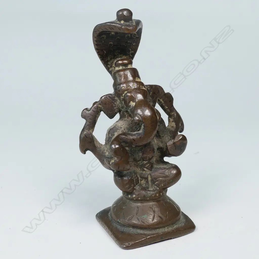INDIAN BRONZE STATUETTE, GANESH SURMOUNTED BY A HOODED SERPENT CANOPY Image 1++