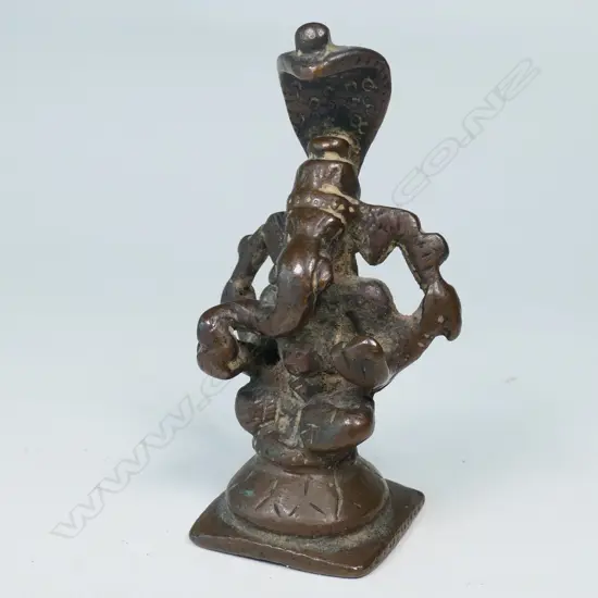 INDIAN BRONZE STATUETTE, GANESH SURMOUNTED BY A HOODED SERPENT CANOPY
