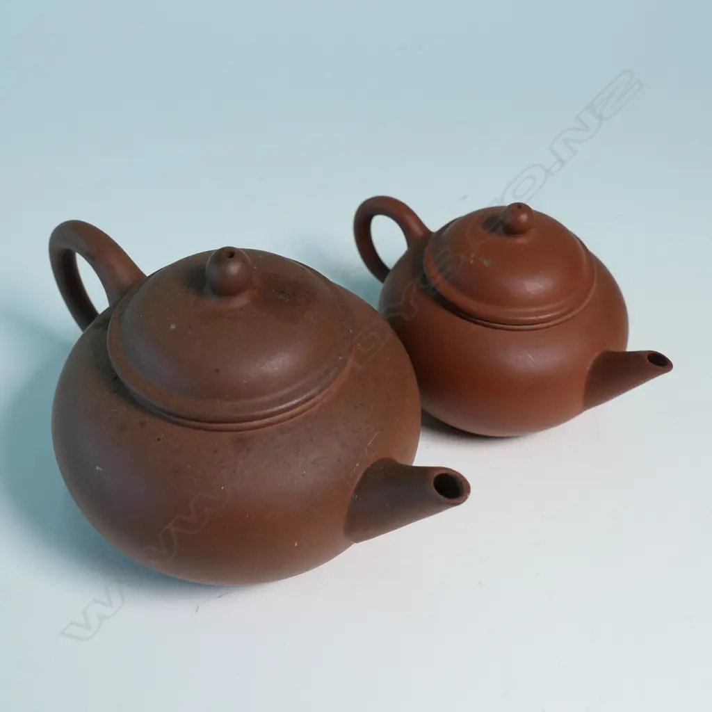 TWO SMALL YIXING TEAPOTS, MARKED 中國宜興. W.120 & 90mm Image 1++