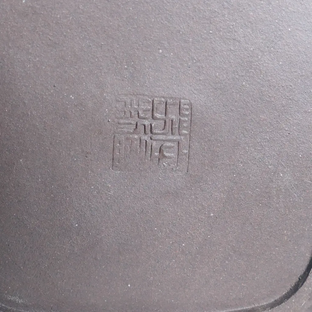 SMALL YIXING TEAPOT, SQUARE SECTION, BAMBOO HANDLE & SPOUT, INDISTINCTLY MARKED. COVER CHIPPED INSIDE. W.125mm... Image 1++