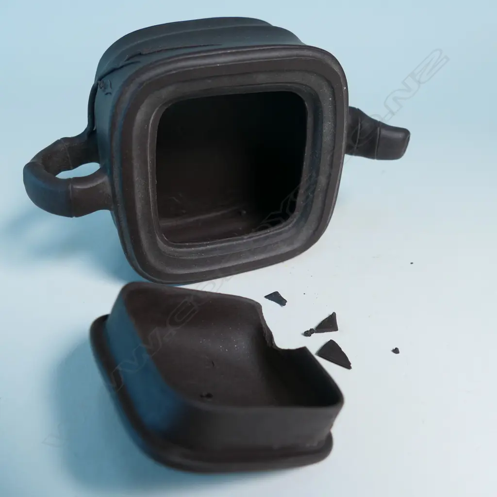 SMALL YIXING TEAPOT, SQUARE SECTION, BAMBOO HANDLE & SPOUT, INDISTINCTLY MARKED. COVER CHIPPED INSIDE. W.125mm... Image 1++