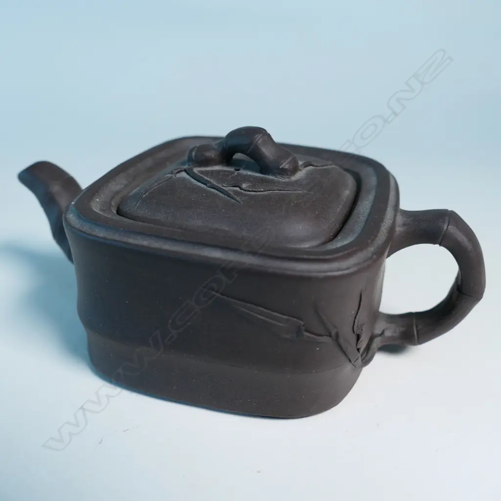 SMALL YIXING TEAPOT, SQUARE SECTION, BAMBOO HANDLE & SPOUT, INDISTINCTLY MARKED. COVER CHIPPED INSIDE. W.125mm... Image 1++