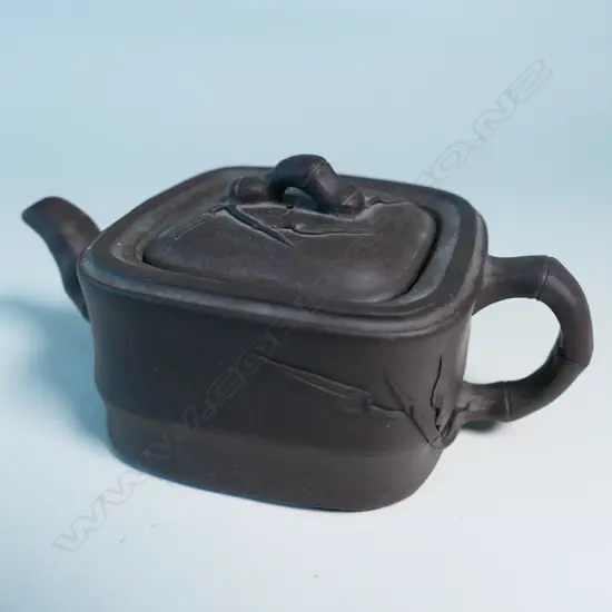 SMALL YIXING TEAPOT, SQUARE SECTION, BAMBOO HANDLE & SPOUT, INDISTINCTLY MARKED. COVER CHIPPED INSIDE. W.125mm...