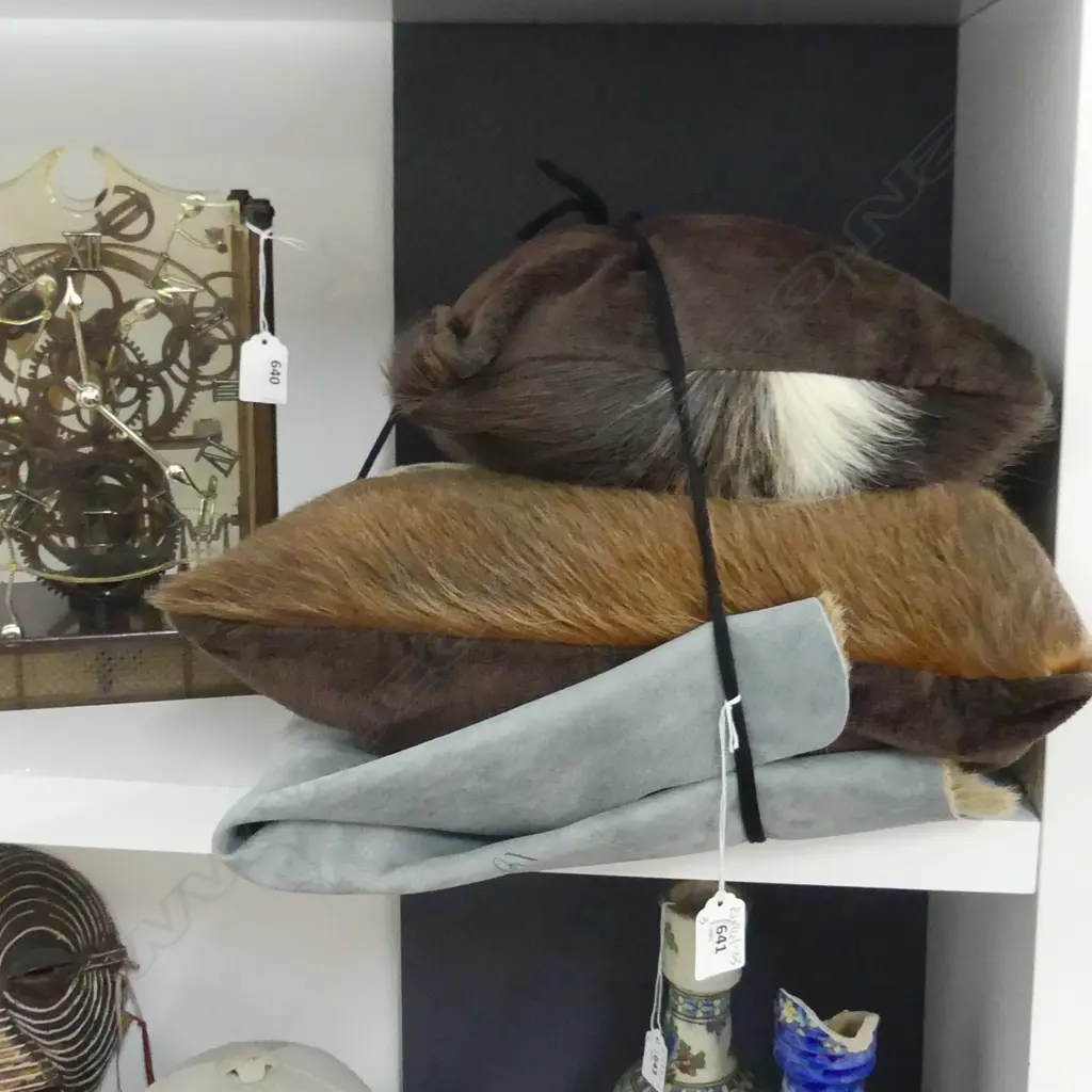 TWO HIDE CUSHIONS AND A HIDE RUG Image 1++