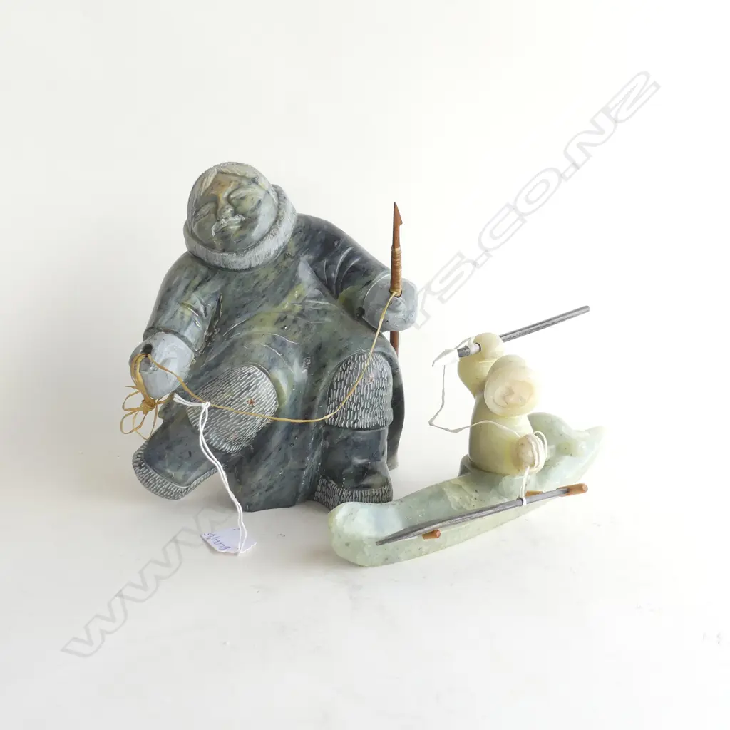 2 ALASKAN INUIT CARVED STONE SCULPTURES; WOMAN H.205mm & CANOE HUNTER L.250mm Image 1++