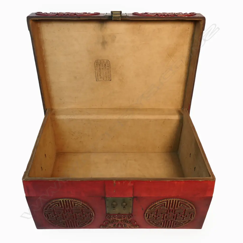 A vintage Chinese chest the exterior in rich sang de boeuf leather decorated with tooled gilt detailed sacred bats and peach kernel medallions brass lock and side handles. 780 x 340 x 1050mm. Image 1++