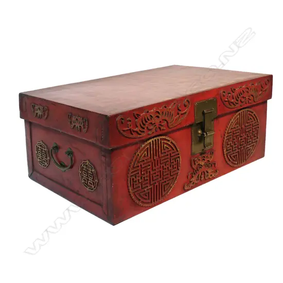 A vintage Chinese chest the exterior in rich sang de boeuf leather decorated with tooled gilt detailed sacred bats and peach kernel medallions brass lock and side handles. 780 x 340 x 1050mm.