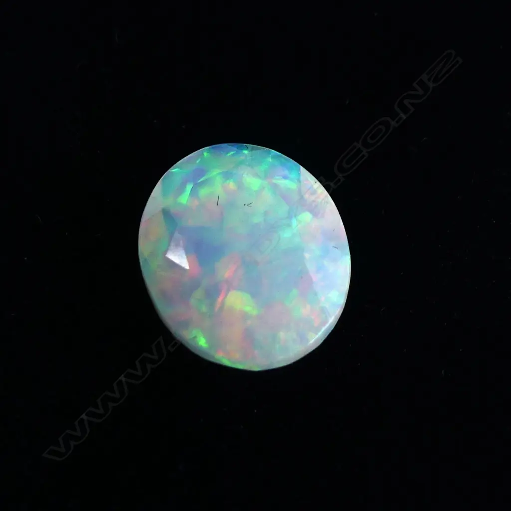OPAL GEMSTONE WHITE WITH COLOUR, OVAL FACET CUT 2.61CTS - WITH AIG REPORT Image 1++