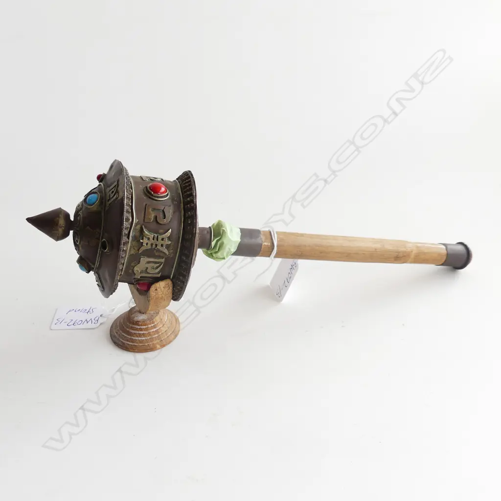 THAI PRAYER WHEEL WITH BLUE AND RED CABACHONS ( ONE MISSING) .300mm LONG  ON STAND  Image 1++