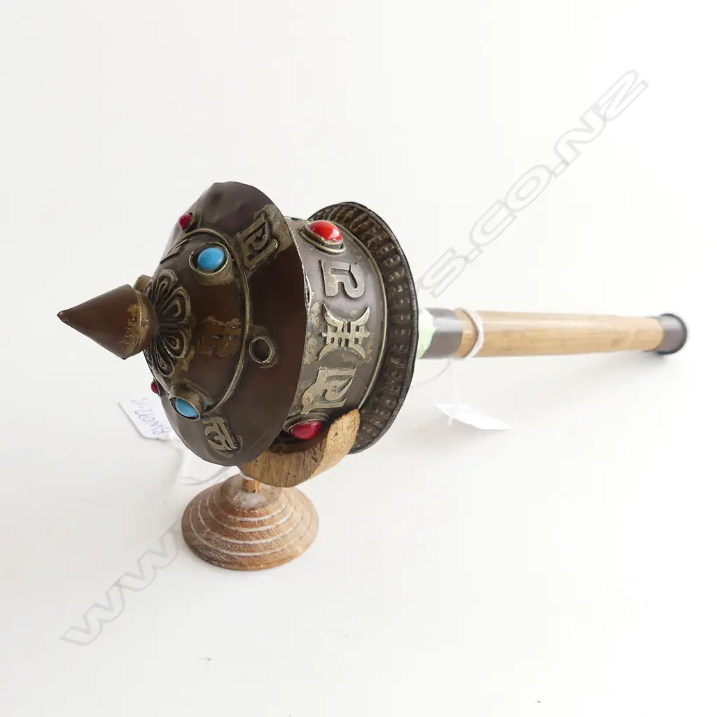 THAI PRAYER WHEEL WITH BLUE AND RED CABACHONS ( ONE MISSING) .300mm LONG  ON STAND  Image 1++