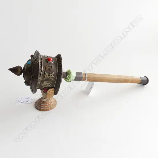 THAI PRAYER WHEEL WITH BLUE AND RED CABACHONS ( ONE MISSING) .300mm LONG  ON STAND 
